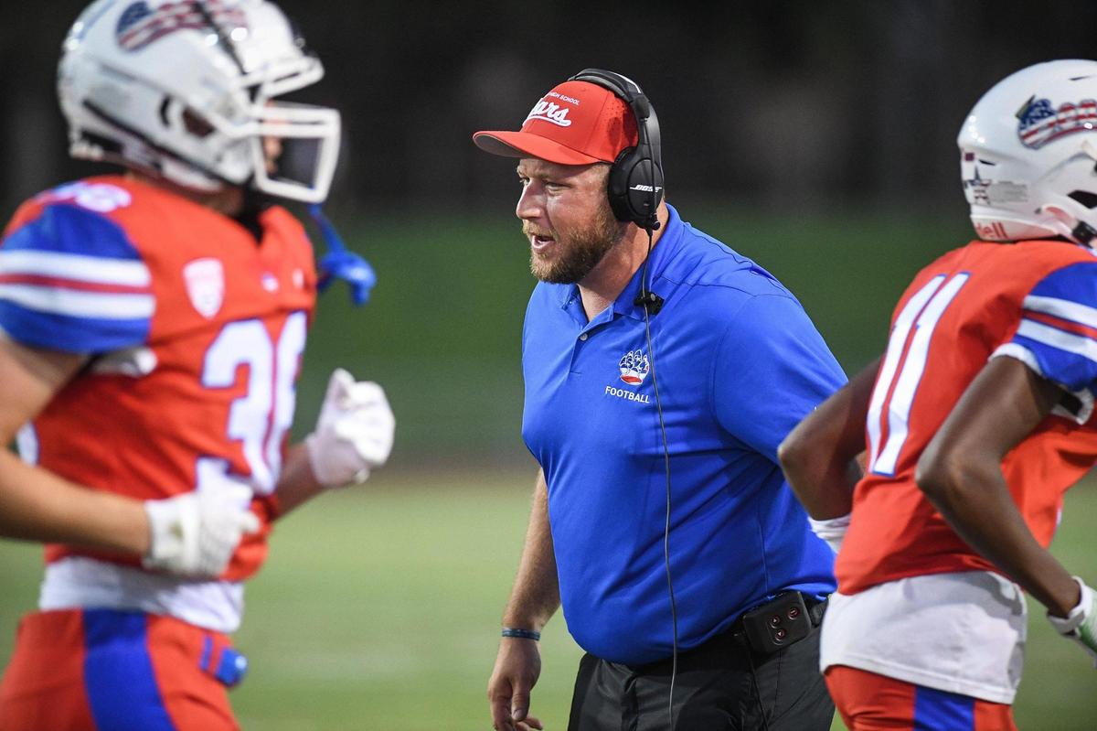 Buchanan head coach Ross Wood congratulates players after scoring against Bakersfield in their game at Veterans Memorial Stadium on Friday, Aug. 19, 2022.