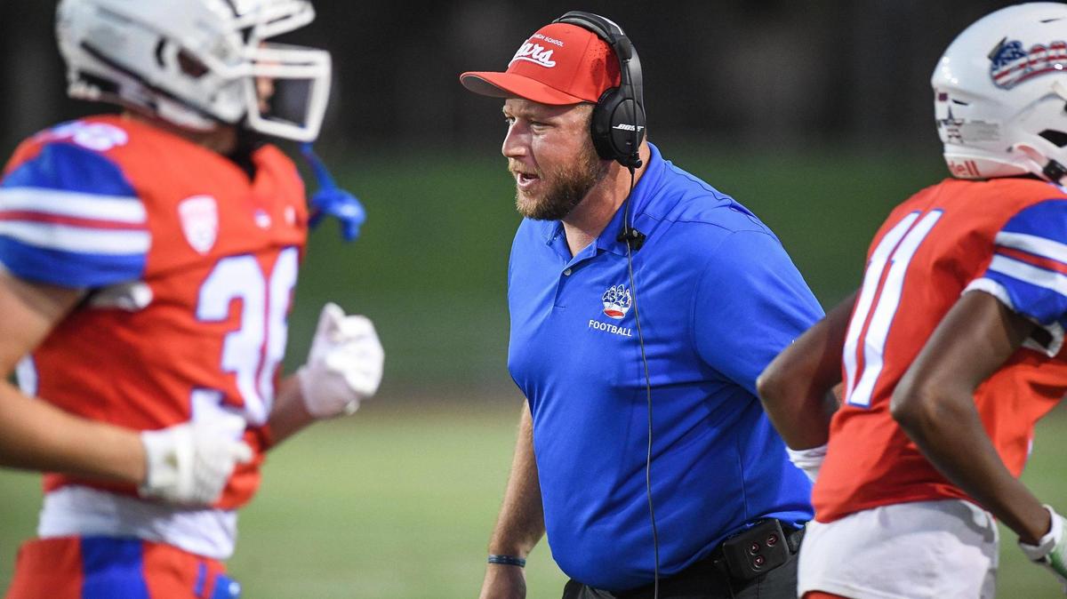 Buchanan head coach Ross Wood congratulates players after scoring against Bakersfield in their game at Veterans Memorial Stadium on Friday, Aug. 19, 2022.