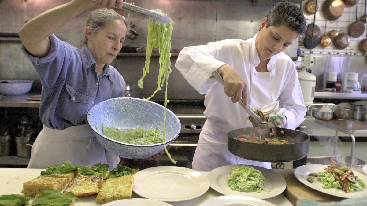 FRESNO 5/10/2001 FNN CP DEAF CHEF - (left to right: Sharon Alexander, chef ; Praxy Arcia , chef ) Alexander and Arcia prepare orders for the lunch crowd at Upstairs Downtown. Neighbors Newspapers