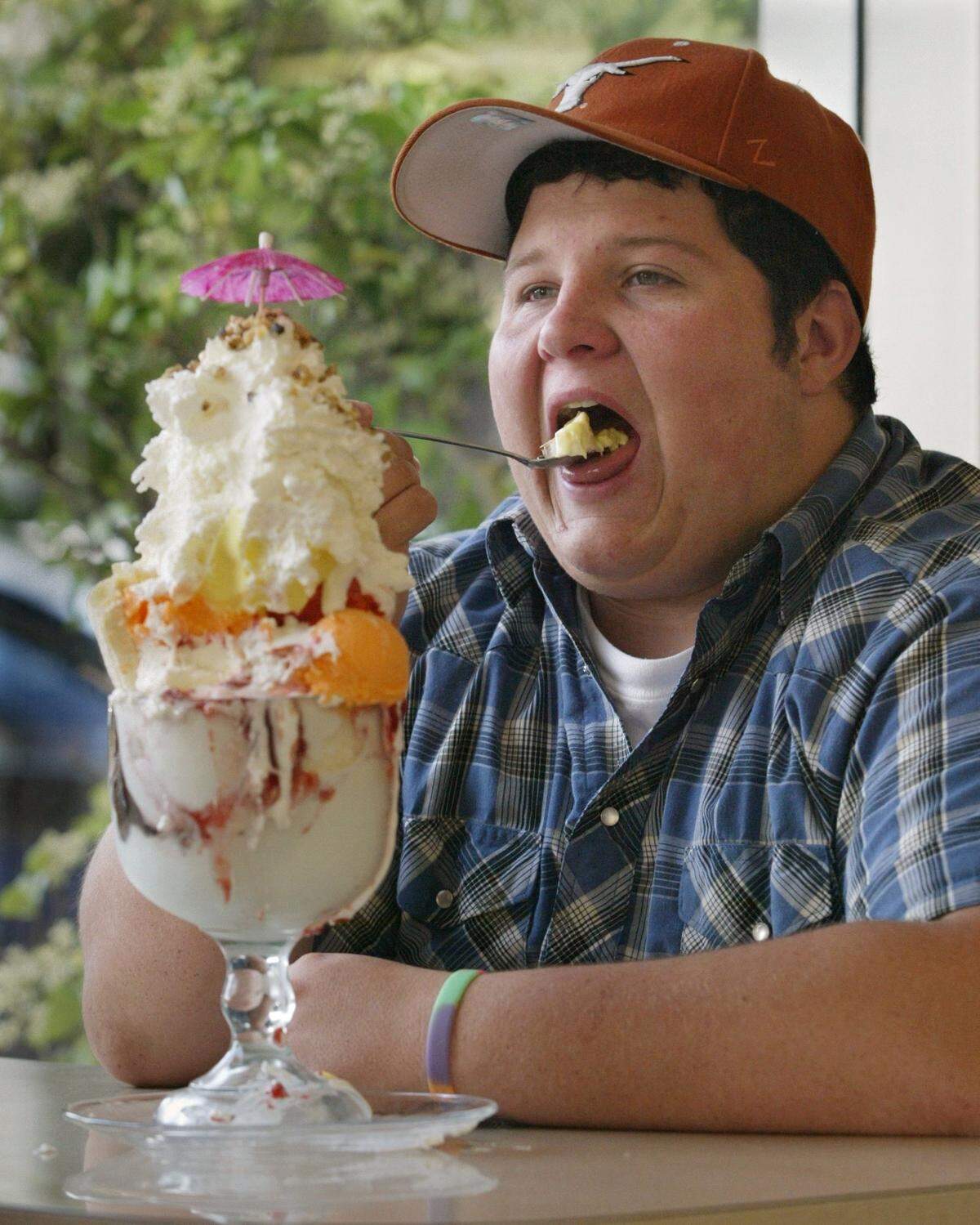 In a Bee file photo from May 2004, Danny Radford, then 18, of Hanford chips away on an S.O.S. or Superior Oversize Sundae at Superior Dairy in Hanford, California. The mammoth concoction featured seven scoops of ice creams and sherbets, hot fudge, strawberry and marshmallow toppings, sliced banana, whip cream, cherries and walnuts with a little umbrella on top.