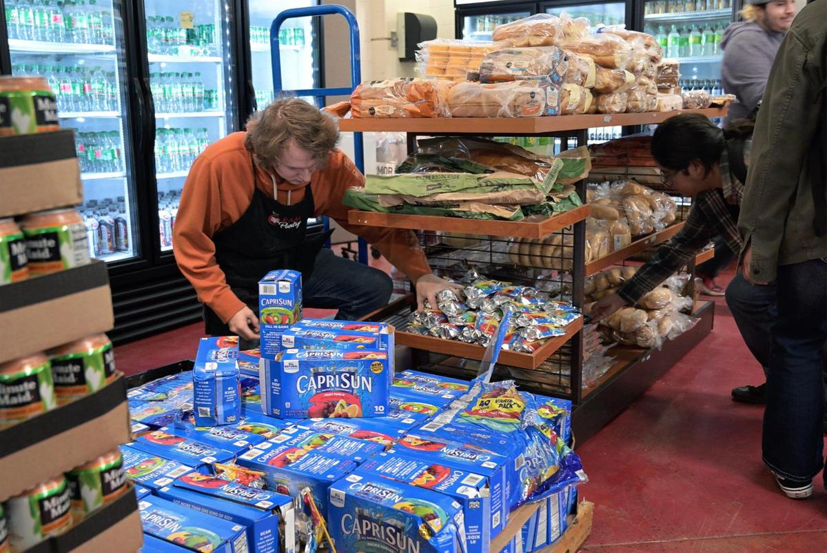 Items are restocked by staff as students shop Fresno City College’s Ram Pantry Monday, Jan. 13, 2025 in Fresno.