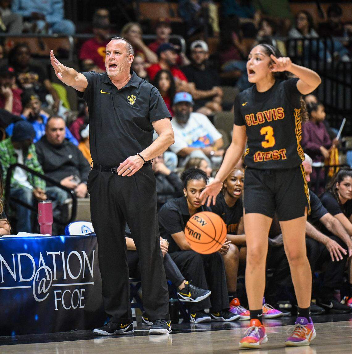 Clovis West girls head basketball coach Craig Campbell directs players as Ramie Chatman takes the ball downcourt during their Central Section Division 1 girls basketball championship game against Clovis at Selland Arena on Saturday, Feb. 28, 2026. 