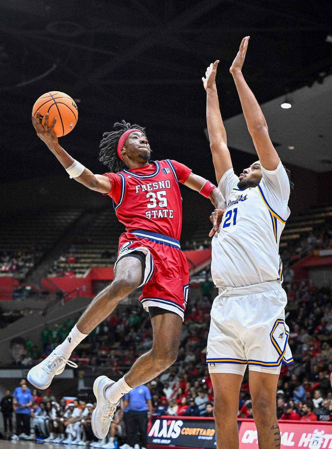 Fresno State's DeShawn Gory, lefty, puts up a shot against CSU Bakersfield's Ronald Jessamy during their non-conference game at Selland Arena in downtown Fresno for the “Return to Selland” game on Sunday, Nov. 30, 2025.