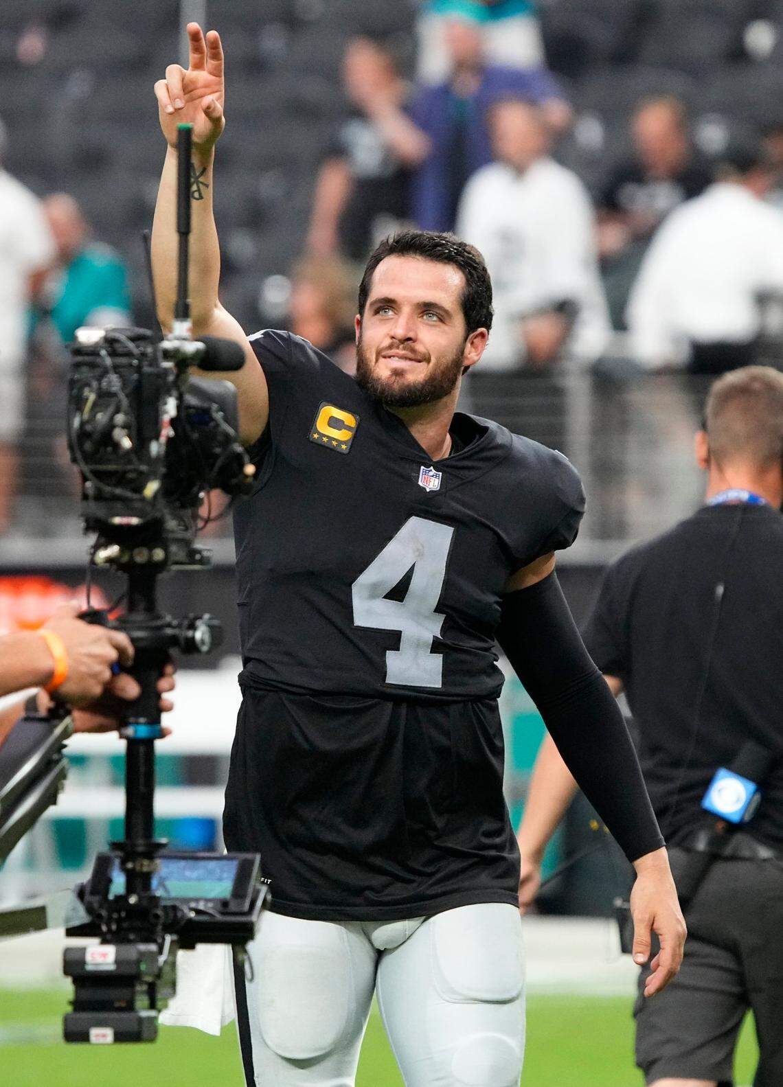 Las Vegas Raiders quarterback Derek Carr (4) reacts after the Las Vegas Raiders defeated the Miami Dolphins in overtime of an NFL football game, Sunday, Sept. 26, 2021, in Las Vegas.
