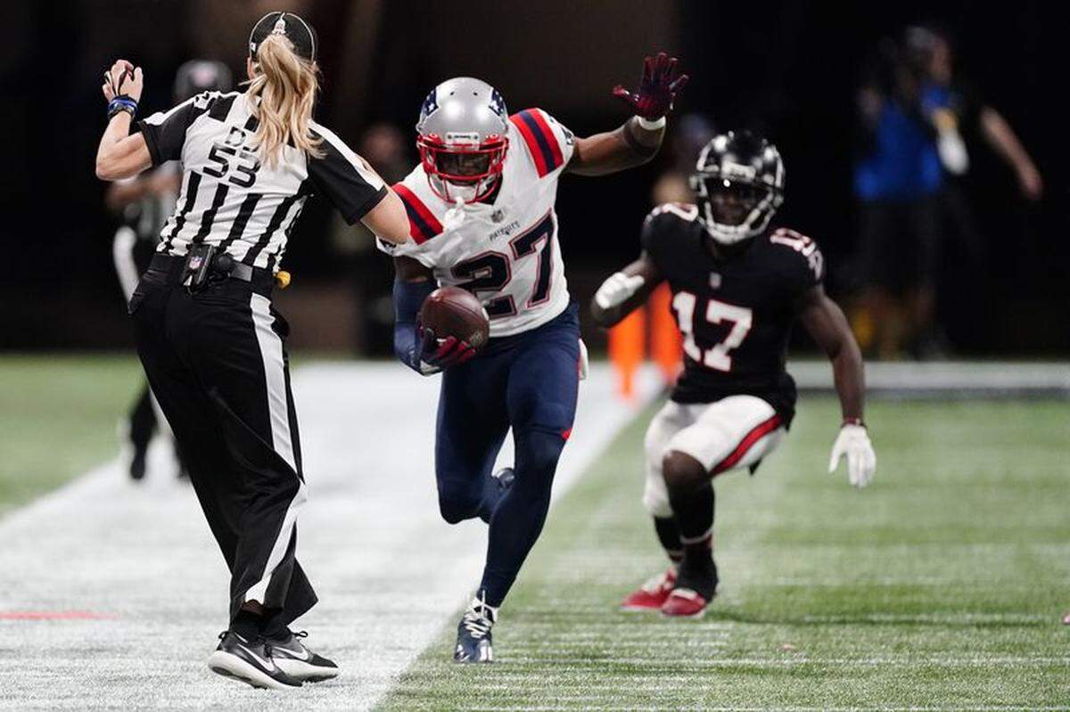 J.C. Jackson runs after his interception against the Atlanta Falcons during the second half of an NFL game, Thursday, Nov. 18, 2021, in Atlanta.