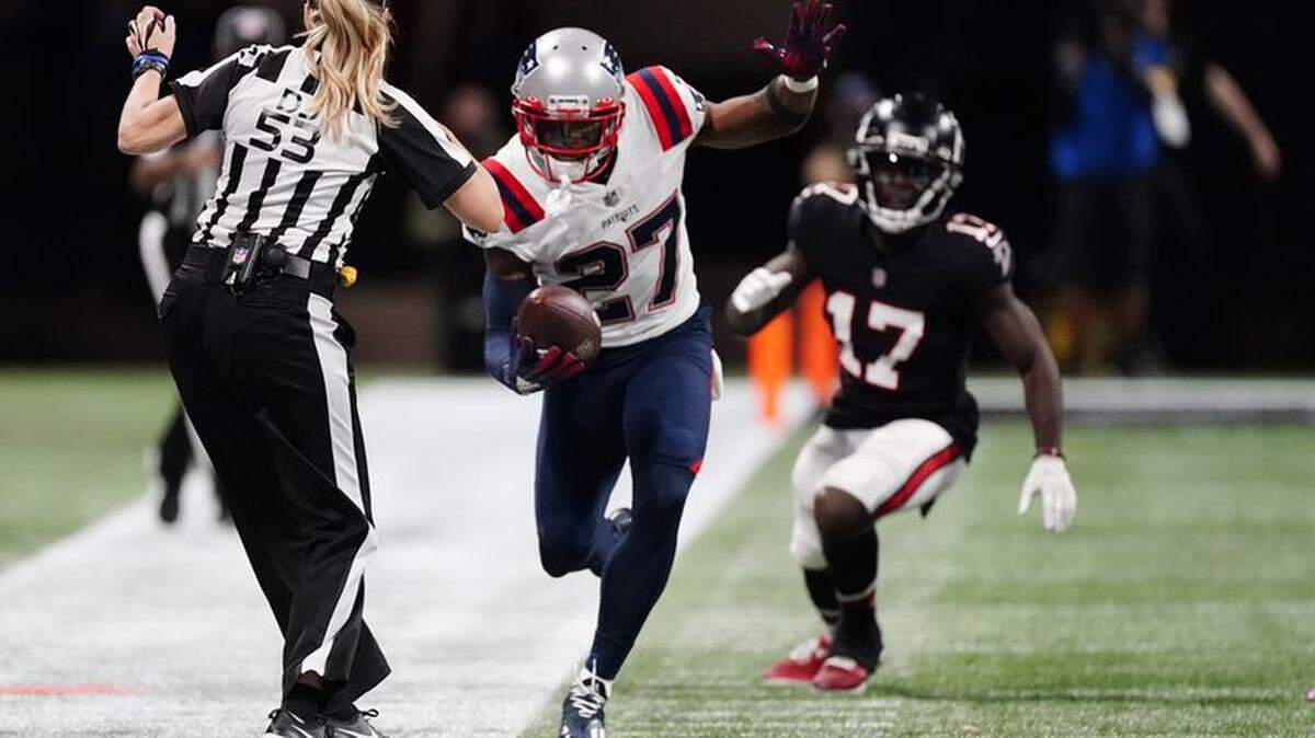 J.C. Jackson runs after his interception against the Atlanta Falcons during the second half of an NFL game, Thursday, Nov. 18, 2021, in Atlanta.