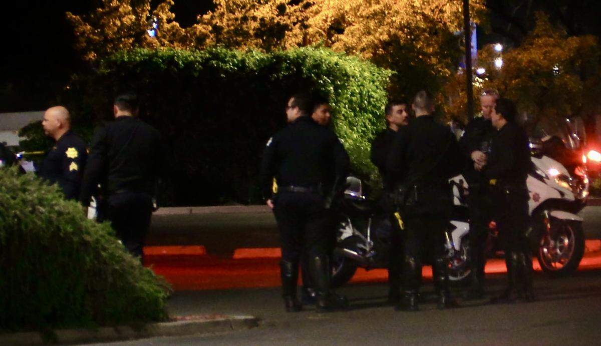 Officers investigate a McDonald’s parking lot after a suspect, believed to be responsible for the shooting in the parking lot outside of a nightclub on Sunday, March 30, 2025, ran to the area.