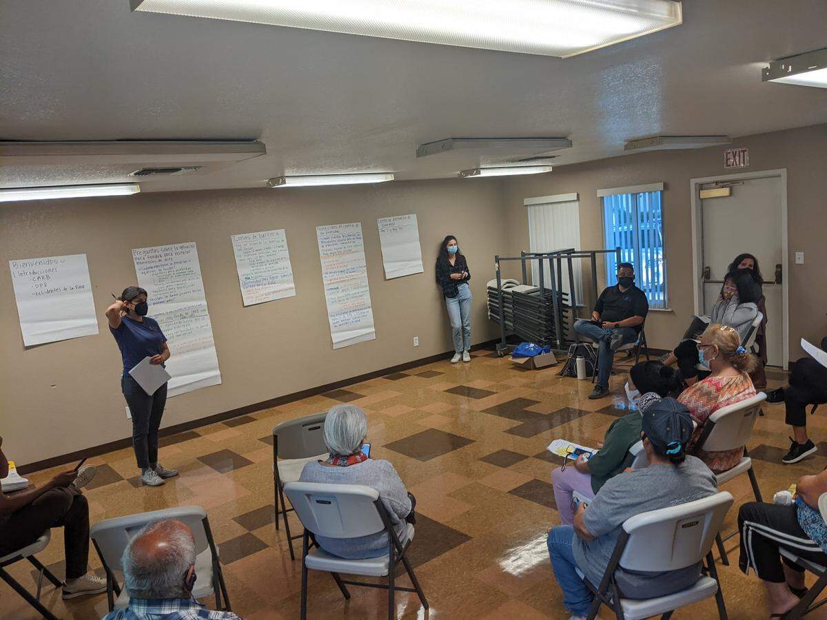 La Vina residents meet officials from the California Air Resources Board, the Department of Pesticide Regulation, and the Office of Environmental Health Hazard Assessment at a local Self-Help Enterprises community room to discuss community pesticide protection programs on May 6, 2022.