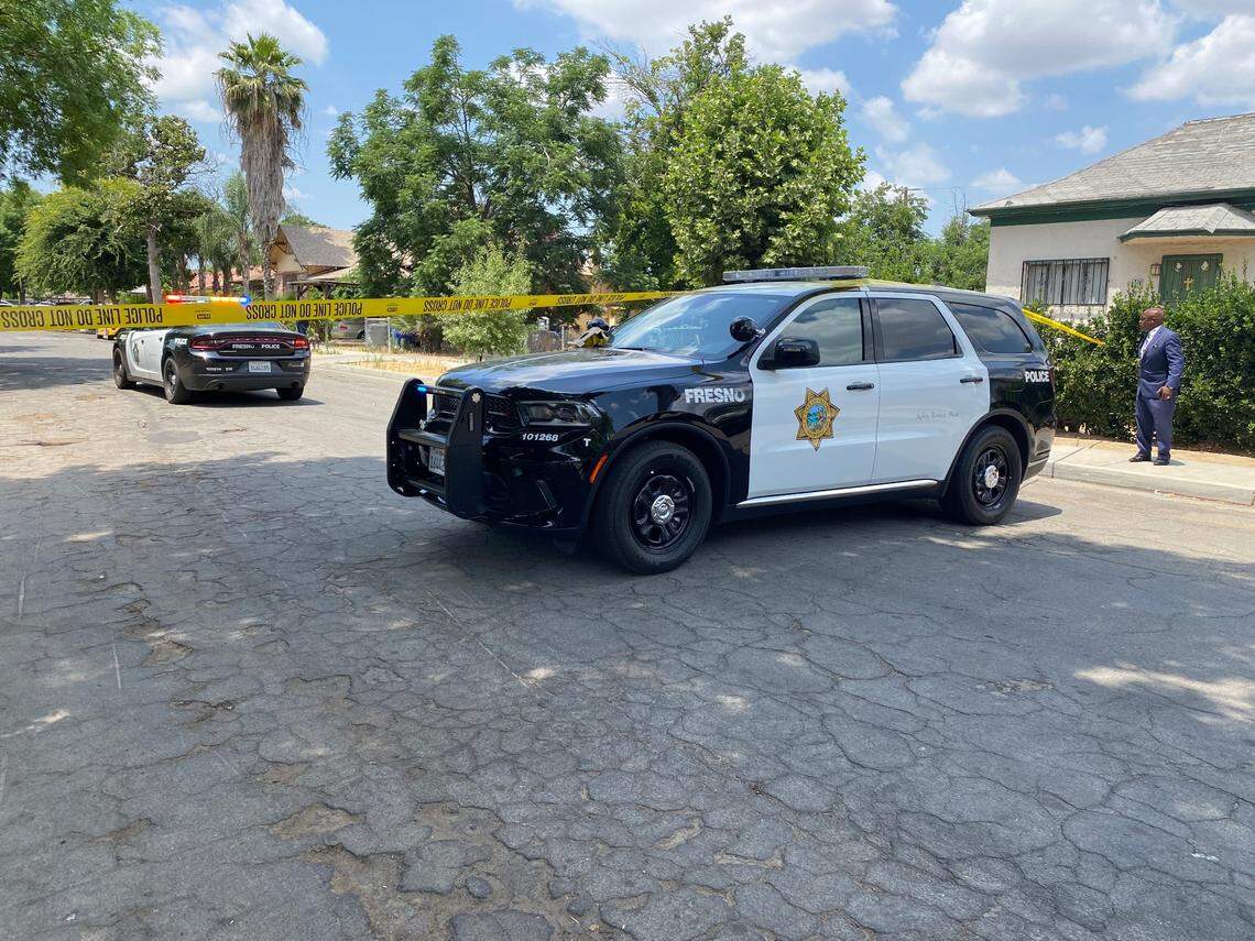 Officers investigate the block where two people were shot Thursday, June 8, 2023, in southwest Fresno, police said.