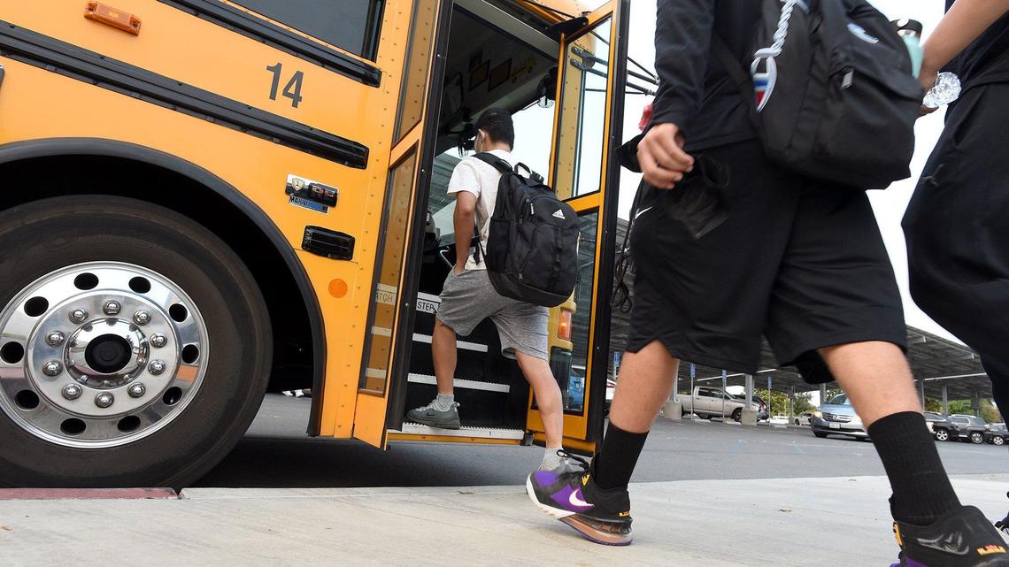 Clovis High students board their bus from campus at 7:20 a.m. Sept. 21, 2021, to go to classes at CART. Starting with the 2022-2023 school year, high schools can start no earlier than 8:30 a.m. in California.