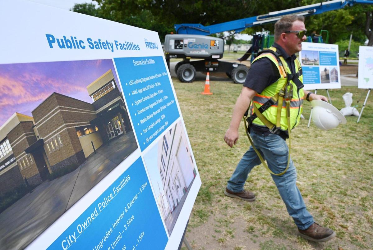 Alliance Building Solutions superintendent Cody Renwick walks through posted plans for a comprehensive city-wide project after a press conference at Sunnyside Park Tuesday, April 26, 2022 in Fresno. Fresno mayor Jerry Dyer announced the project which will replace park and other city facilities with energy saving devices like LED lighting, saving the city an estimated $22.6 million over the next 20 years.