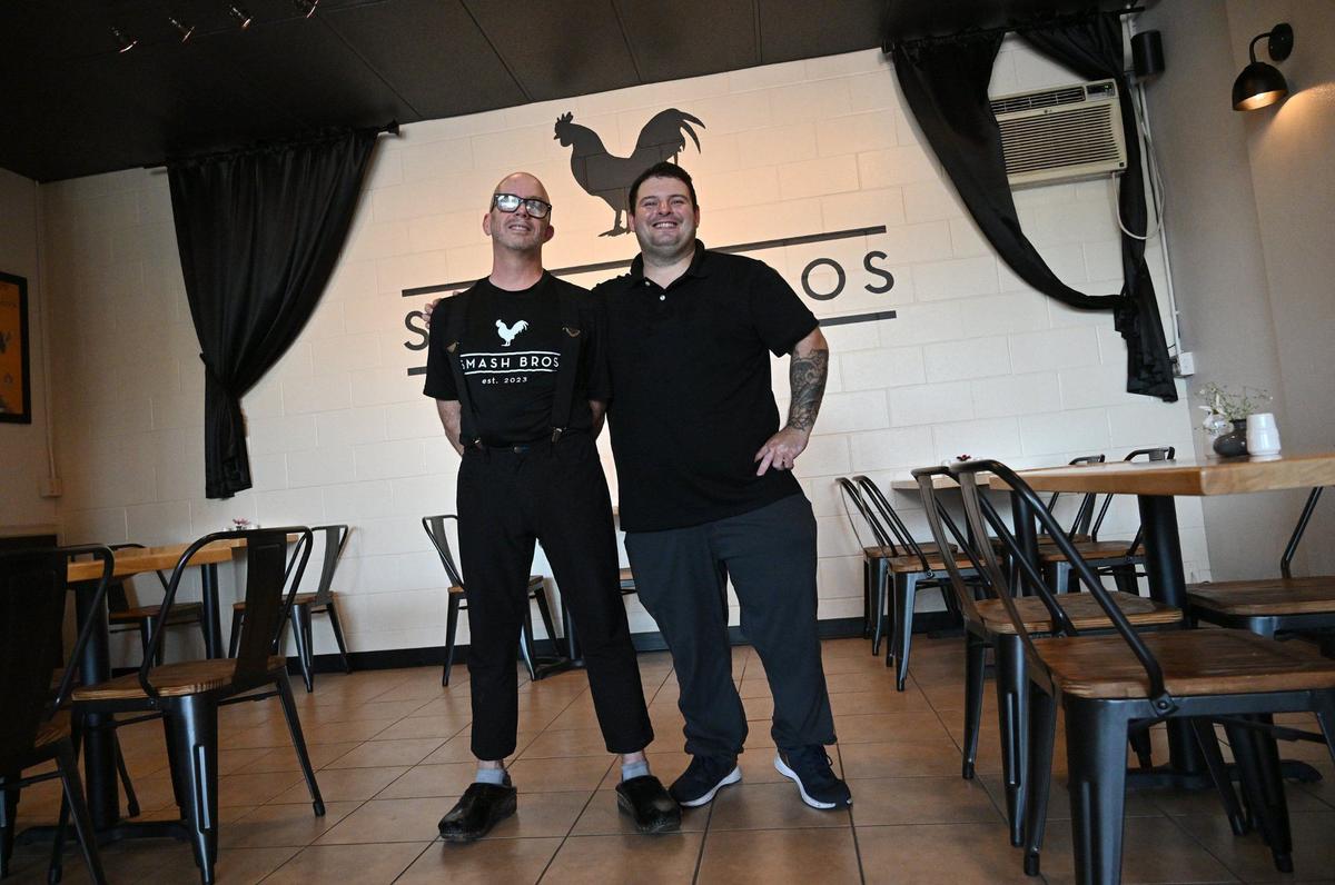 Chefs Matthew Simons, left, and Jonathan Aviles, right, have opened Smash Bros Bistro at Fresno Street and Bullard Avenue, serving much more than smashburgers.