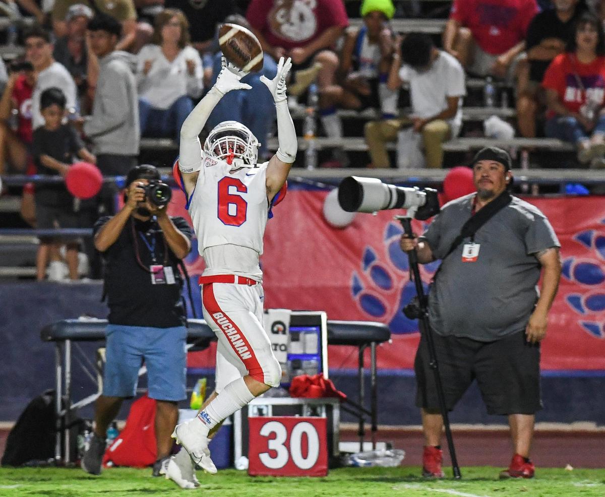 Buchanan’s Colton O’Toole catches a pass along the sideline during during their game against Memorial at San Joaquin Memorial on Friday, Sept. 16, 2022.