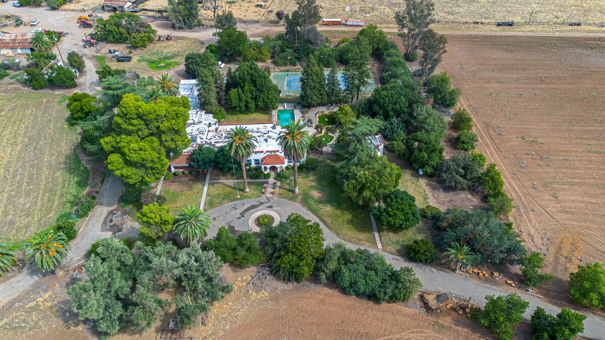 A 107-year-old Balfe Ranch House in Clovis with 535 acres, pool, tennis court and historic ties to Hollywood is listed for $25 million near Herndon Avenue.