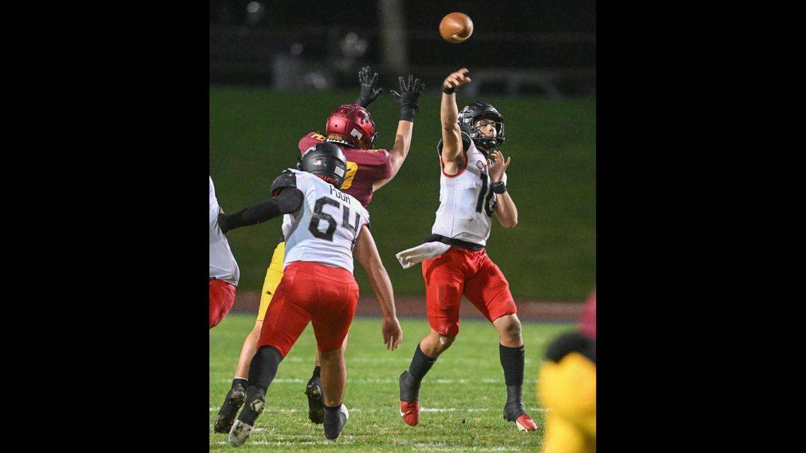 Hanford quarterback Daniel Gomez throws downfield against Clovis West in their first-round Central Section playoff game at Veterans Memorial Stadium in Clovis on Friday, Nov. 3, 2023.