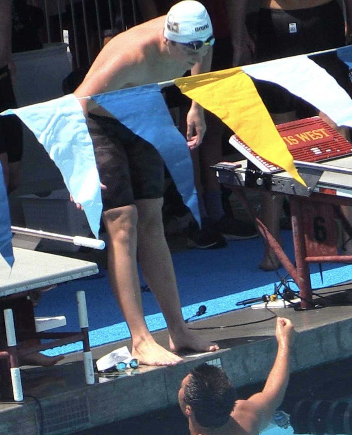 Tobin Reed congratulates Stanley Oka for helping the 200 freestyle relay win the CIF state championships on Saturday, May 17, 2025.