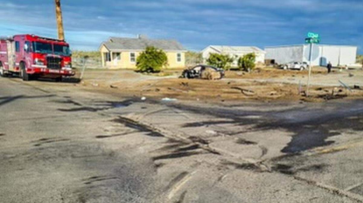 Skid marks and debris mark the site of a two-car crash Saturday morning, March 5, 2022, at Mt. Whitney Avenue and Cedar Street in southern Fresno County. A teenage passenger in a Honda Accord, at center, died in the collision. Three other people, including two in the silver Lexus sedan, right, received major injuries.