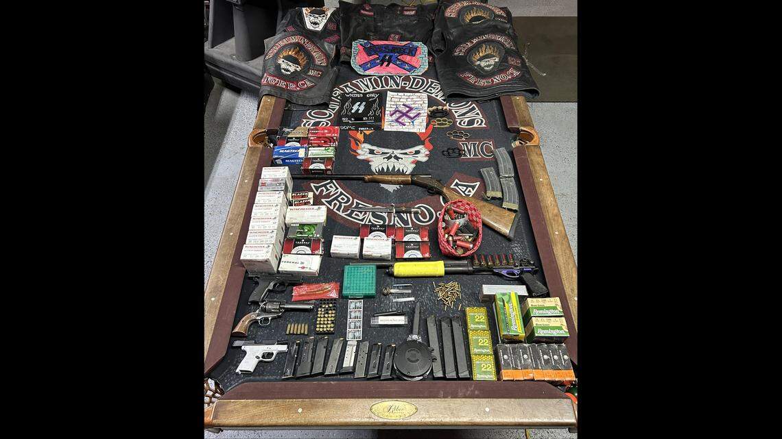 Deputies seized guns and white supremacist paraphernalia from the clubhouse of the Screamin-Demons in Sanger after the arrest of its president on May 2, 2025, according to the Fresno County Sheriff’s Office.