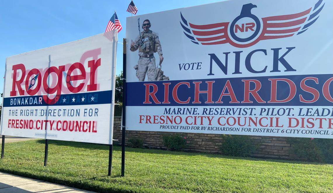 Campaign signs for Fresno City Council District 6 candidates Roger Bonakdar and Nick Richardson compete for attention at the corner of Perrin Avenue and Sommerville Drive in northeast Fresno.