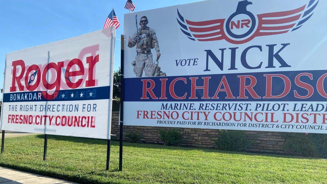 Campaign signs for Fresno City Council District 6 candidates Roger Bonakdar and Nick Richardson compete for attention at the corner of Perrin Avenue and Sommerville Drive in northeast Fresno.