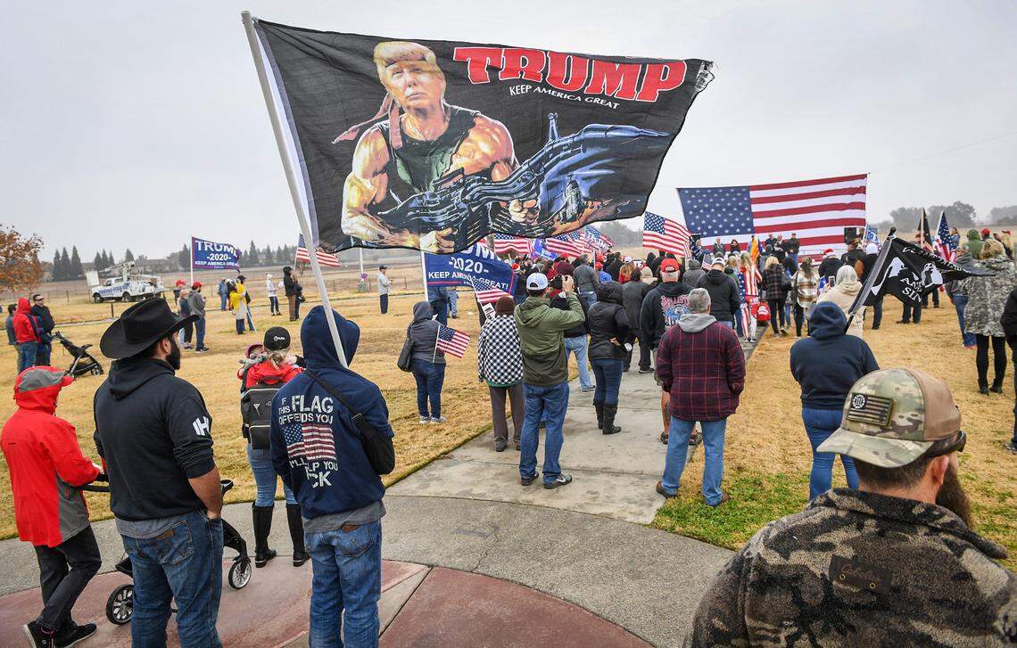 Donald Trump supporters listen to speakers during a pro Trump rally hosted by the Fresno County Republican Party at Sierra Meadows Park in Clovis on Saturday, Dec. 12, 2020.