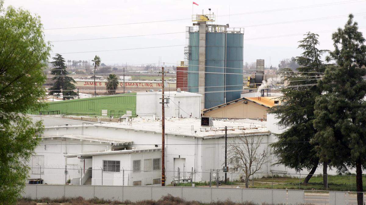 The Darling rendering plant is seen at center from Hyde Park, a neighborhood park in southwest Fresno.