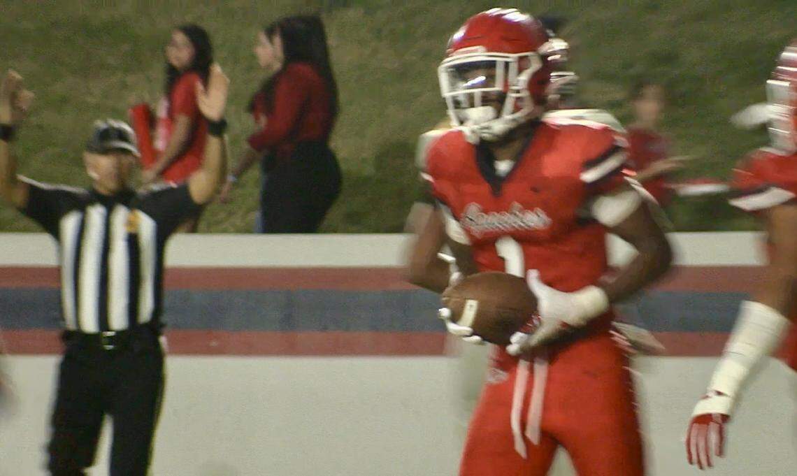 Bryson Baker scores on a run for Sanger High against Hanford on Friday, Aug. 30, 2024.