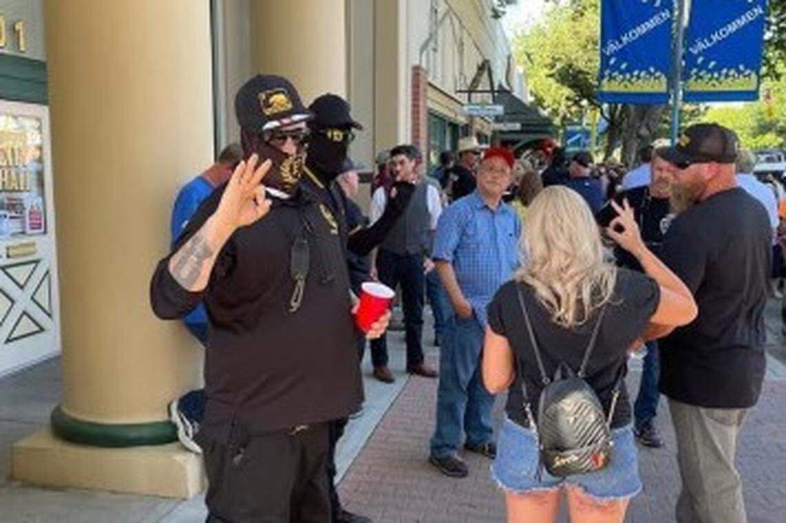 Proud Boys holding up an “OK” hand symbol, which has been co-opted as a white supremacist symbol, were seen in downtown Kingsburg during the City Council meeting that featured a proposed recognition of Pride Month on Wednesday, May 19, 2021.