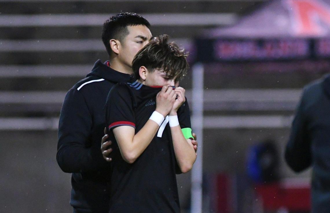 McLane’s Cristian Garcia, left, is consoled after Terra Linda’s 2-0 win in the CIF Northern California Regional Division III boys soccer championship Saturday, March 4, 2023 in Fresno.