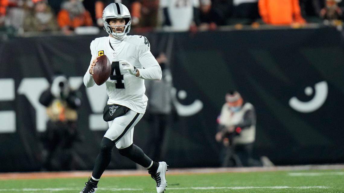 Las Vegas Raiders quarterback Derek Carr throws during the first half of an NFL wild-card playoff football game against the Cincinnati Bengals, Saturday, Jan. 15, 2022, in Cincinnati.