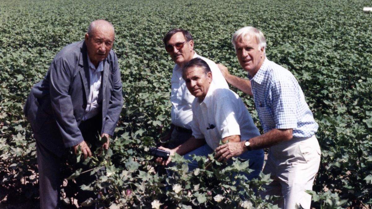 Dick Telles, second left, Jack Woolf and Sam Reeves with a farmer in Uzbekistan in 1989.