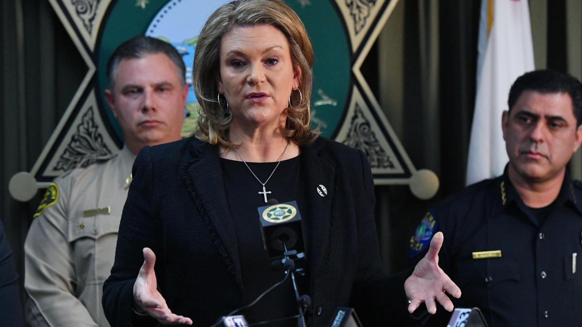 In a Bee file photo, Fresno County District Attorney Lisa Smittcamp, center, is flanked by Fresno County Sheriff John Zanoni, left, and Selma Police Chief Rudy Alcaraz during a 2023 news conference.