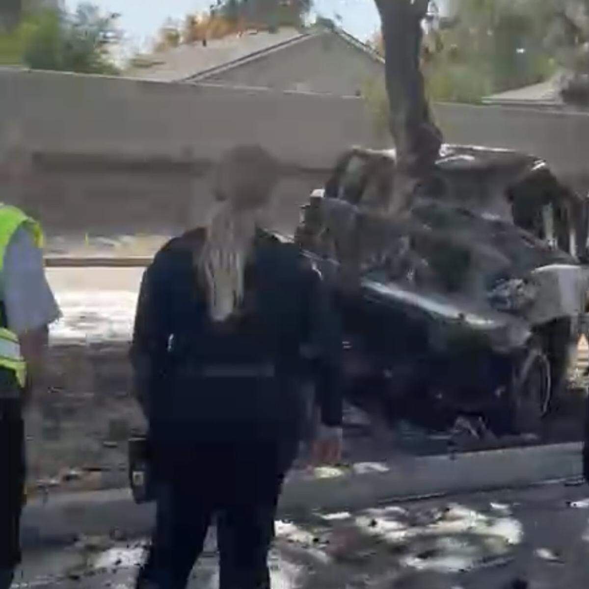 A truck caught on fire after colliding with a tree Monday, Nov. 10, 2025, near Woodward Park in Fresno, California.