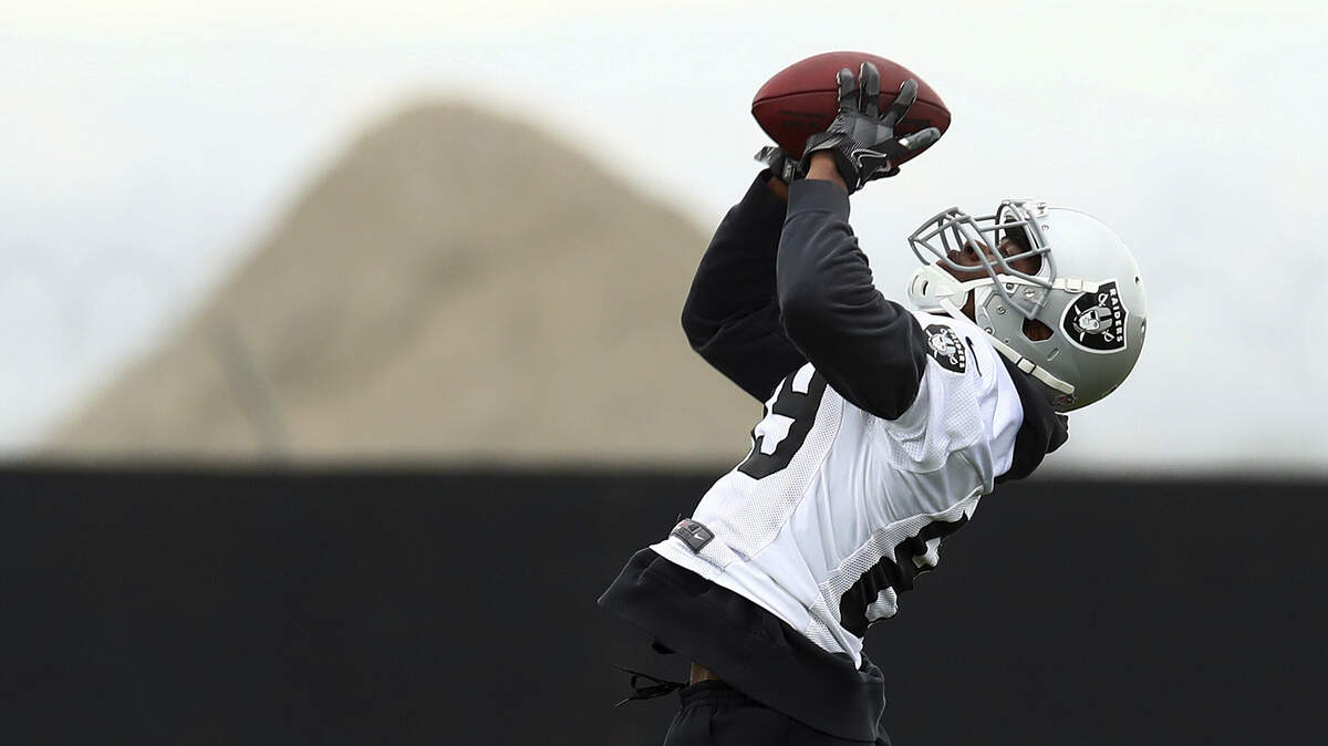 Oakland Raiders' Amari Cooper makes a catch during NFL football practice on Tuesday, May 22, 2018, at the team's training facility in Alameda, CA.