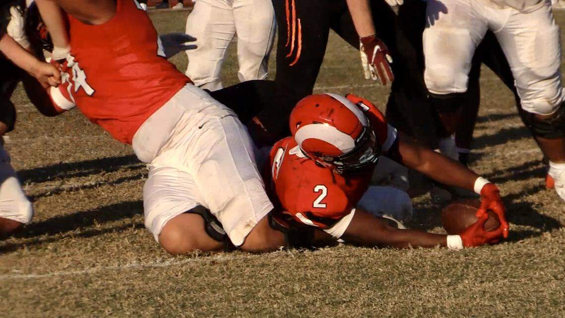 Ah’Marion Gaines-Smith reaches for the end zone in Fresno City’s win over Reedley in the annual Battle for the Pump on Saturday, Nov. 16, 2024.