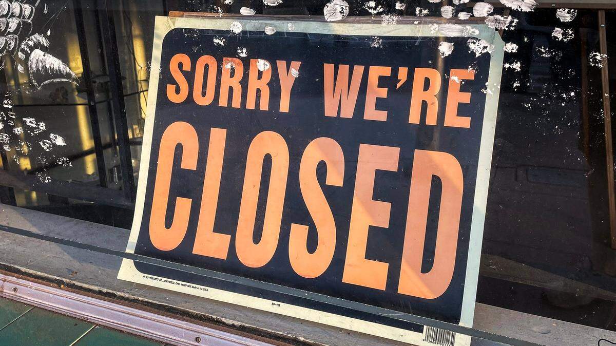 “Sorry, we’re closed” sign posted outside a Tower District business in Fresno on Thursday, Aug. 1, 2024.