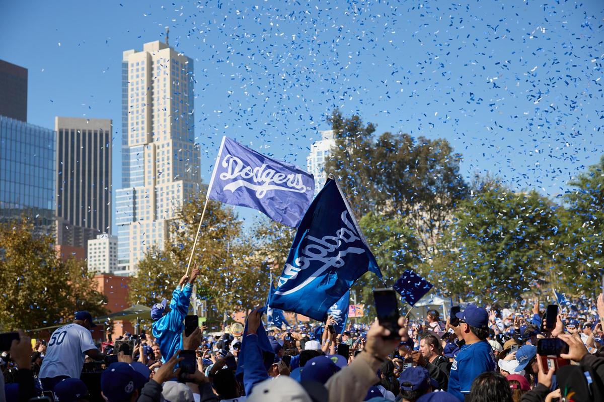 Fans cheer as the Los Angeles Dodgers celebrate their World Series victory with a parade in Los Angeles, California, USA, 01 November 2024.