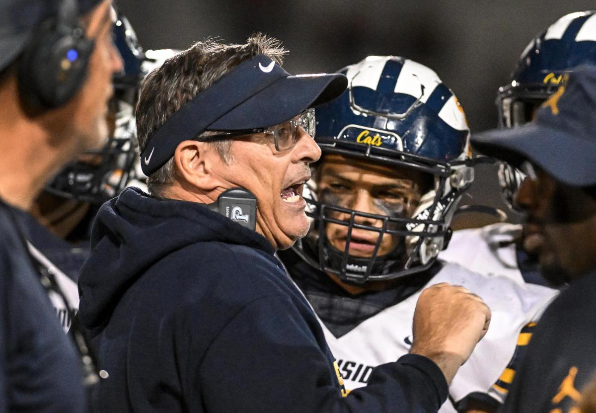 Sunnyside football coach Thomas Wilson talks with his players during a timeout in their game against Torres at the Madera South High football stadium on Friday, Oct. 13, 2023.