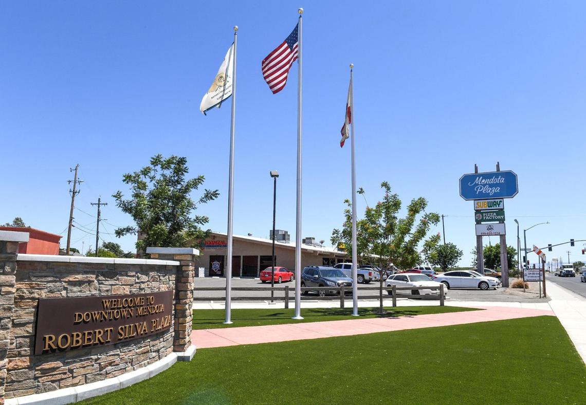 Flags wave at the Robert Silva Plaza in downtown Mendota on Thursday, June 10, 2021.