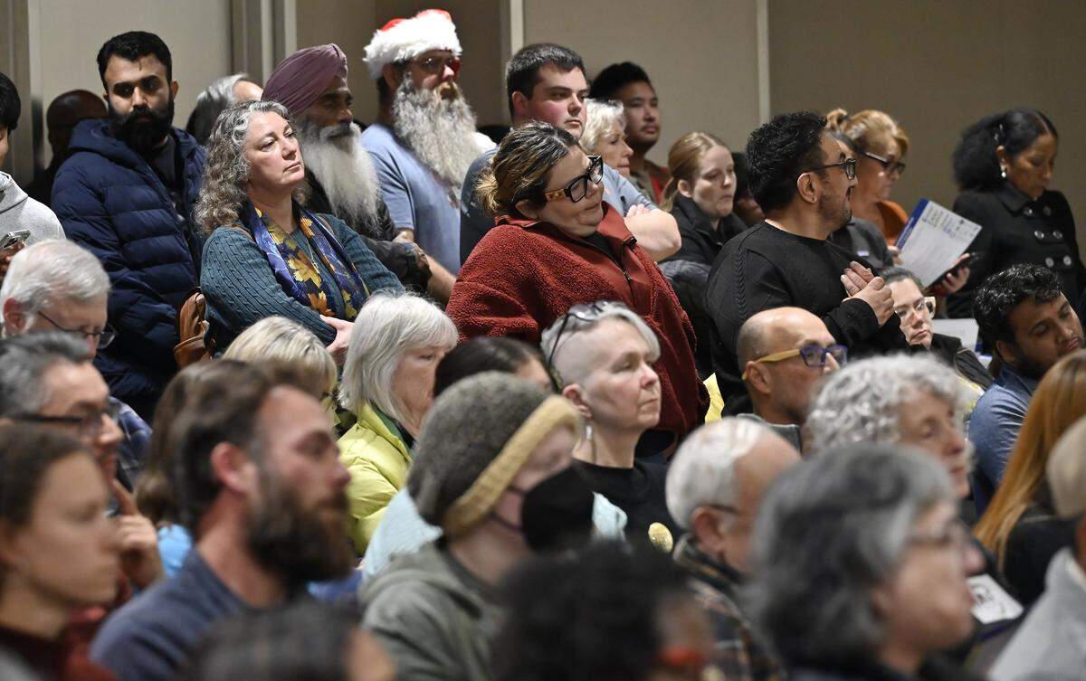 Hundreds gather spilling, inside and outside the council chambers and balcony, attending a special Fresno City Council meeting for the public to voice concerns for the Southeast Development Area (SEDA) plan, held at Fresno City Hall Thursday evening, Dec. 18, 2025 in Fresno.