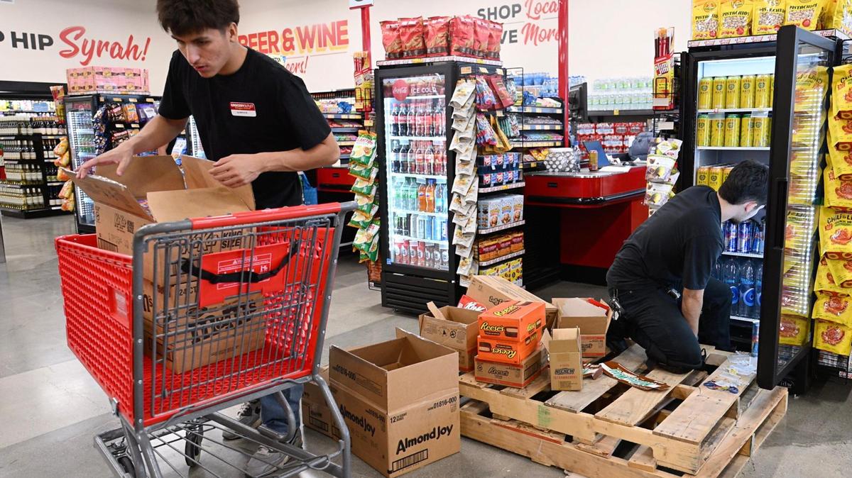 Staff stock items at the new Grocery Outlet located at Nees and Willow avenues Tuesday, July 15, 2025 in Fresno. The grand opening is scheduled for Thursday, July 17.