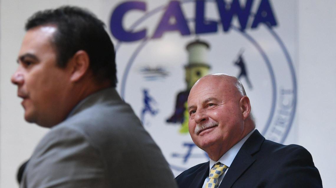 Fresno Mayor Jerry Dyer, right, listens as Aaron Aguirre, Director of Parks, After School, Recreation and Community Services for the City of Fresno explains details about possible annexation of the community of Calwa during a Calwa Recreation & Park District board meeting Tuesday evening, Oct. 18, 2022 in Calwa. Dyer explained annexation of residential areas could have benefits for Calwa but it would be up to the community.