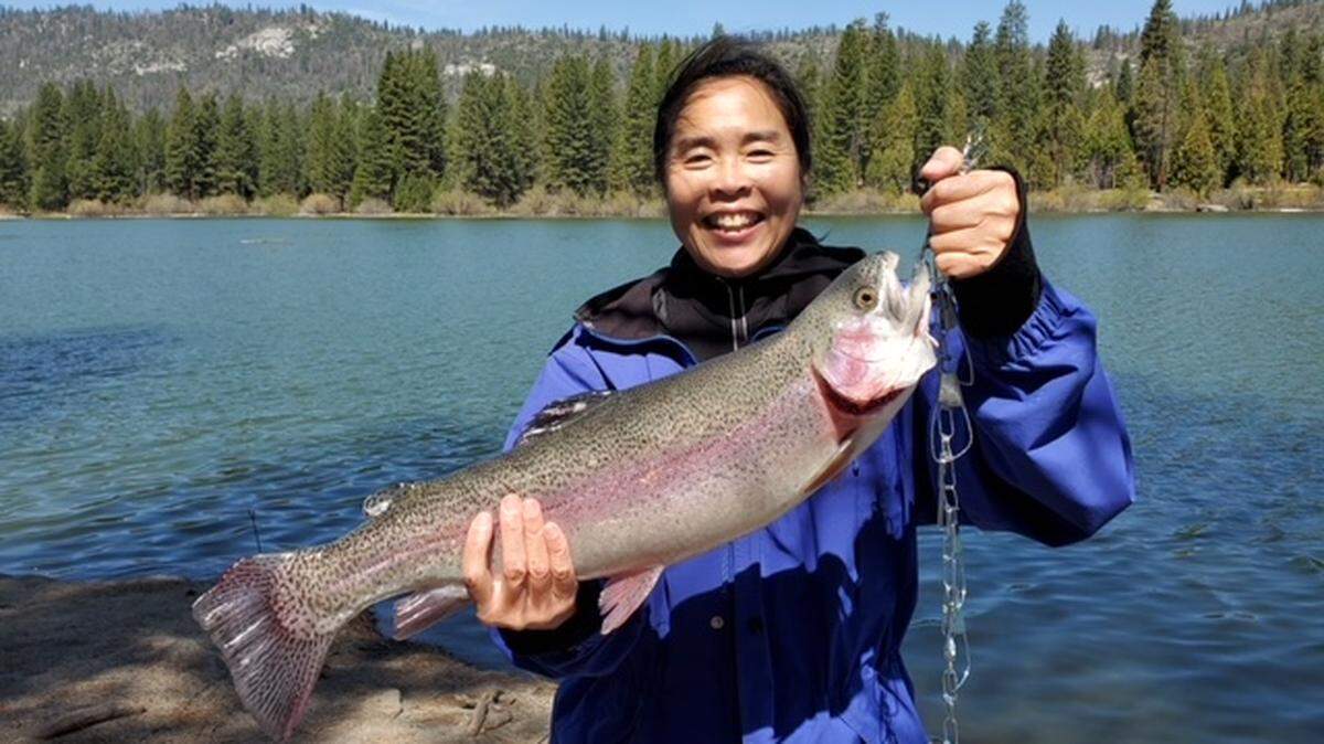 Leng Tan shows off her 6-pound rainbow trout caught at Hume Lake using 4-pound test line and red Power Eggs. Her husband, Susumu, writes, “We were celebrating our 29th wedding anniversary this week and she always jokingly tells friends that when we got married, the marriage contract says that I deal with the worms and cleaning of fish! Little did I know when we got married, she would learn to regularly catch more and bigger fish than me. My big fish of the trip was a 4.25-pounder caught off green Power Bait so I’ll send you her picture instead. :)”
