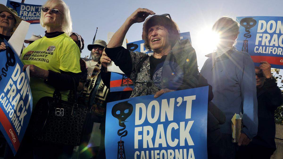A group of protesters against fracking gathers outside Fresno City Hall in 2014.