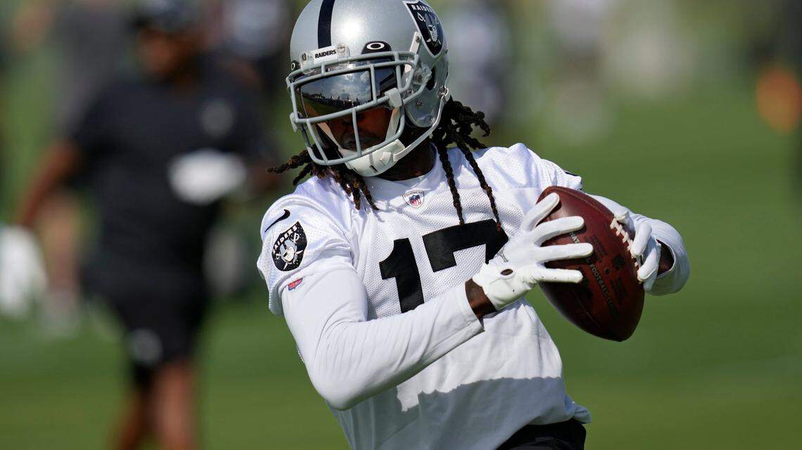 Las Vegas Raiders’ Davante Adams catches a pass during NFL football training camp, Friday, July 22, 2022, in Henderson, Nev.