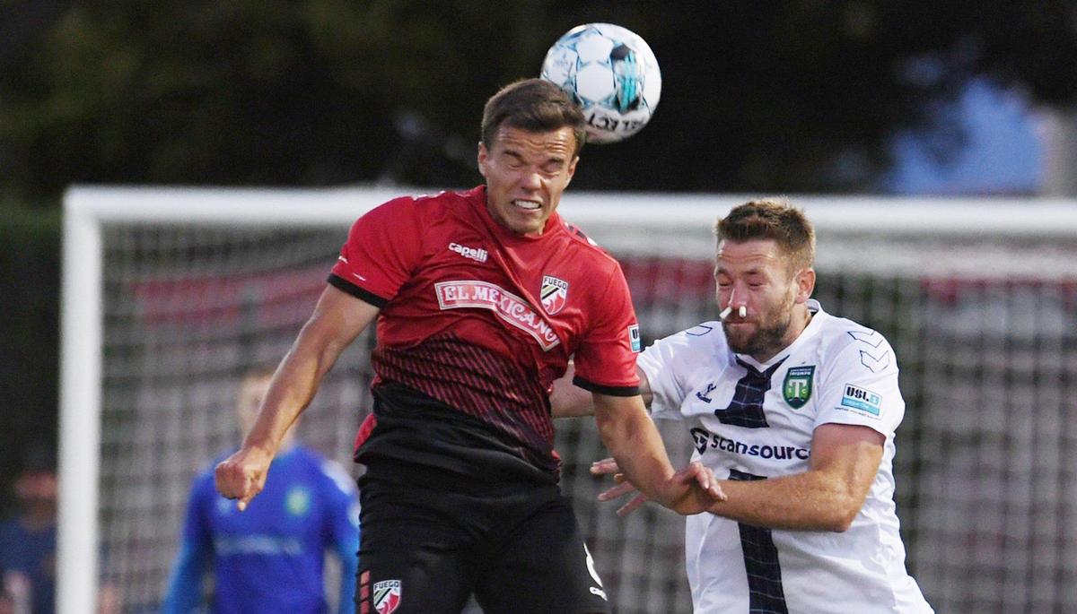 Central Valley Fuego FC’s Victor Falck, left, with Greenville Triumph SC’s Evan Lee, right, in the Fuego’s home opener Saturday night, May 7, 2022 in Fresno. Final score, 1-1.