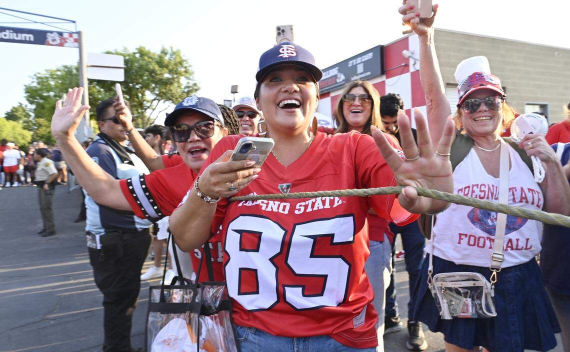 Fans greet the Fresno State players before the game against Georgia Southern Saturday, Aug. 30, 2025 in Fresno.