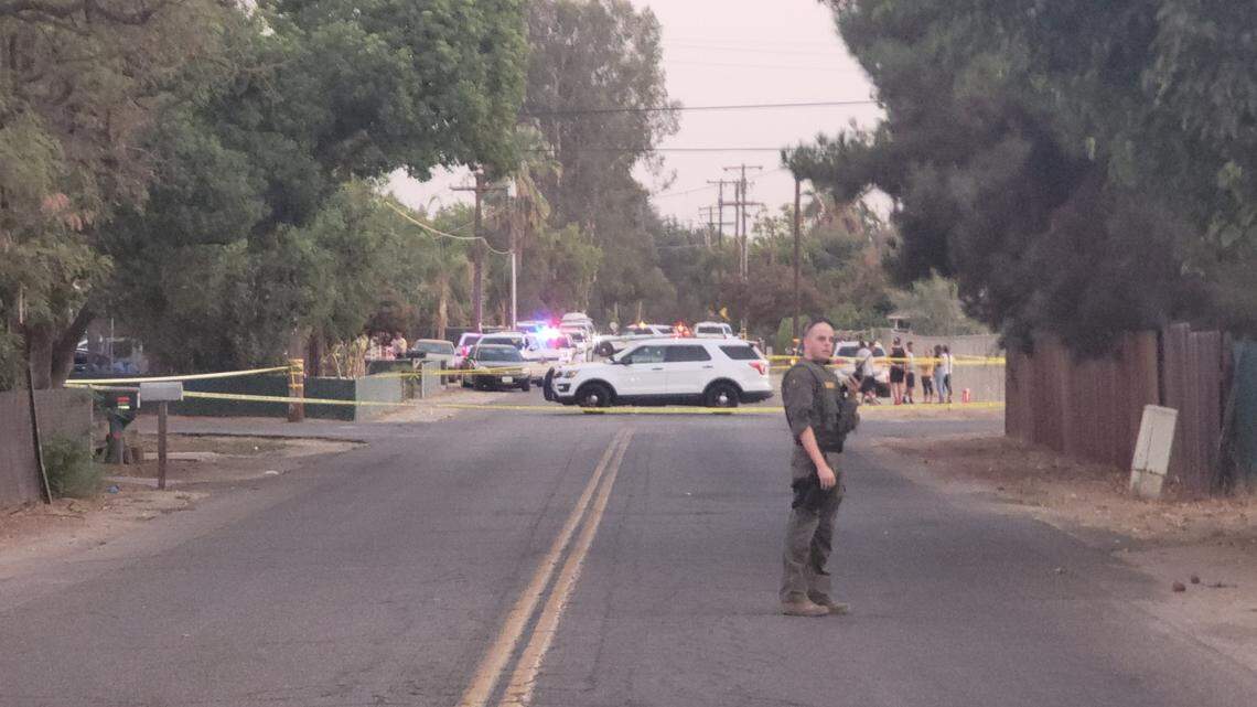 Law enforcement close off the scene after an officer-involved shooting involving a deputy with the Fresno County Sheriff’s Office in the 1100 block of North Valentine Avenue in Fresno, California, on Monday, Sept. 20, 2021.