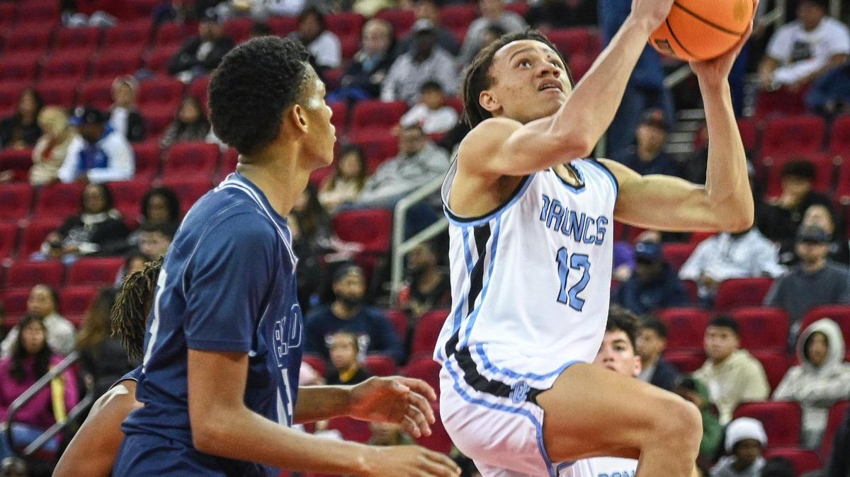 Clovis North’s Jaylen Bryant goes to the hoop while guarded by Bullard’s Kyshawn Johnson in the championship game of Valley Children’s Tip-Off Invitational at the Save Mart Center on Saturday, Dec. 3, 2022. Clovis North defeated Bullard 75-54.