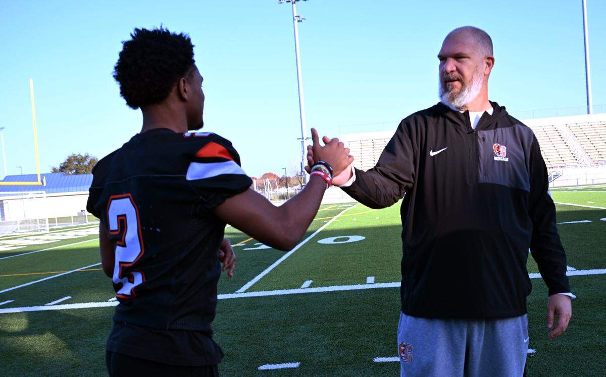 Central East's Brandon Smith, left, the Bee's Player of the Year in football shown with Coach of the Year Kyle Boggs, right, Wednesday, Dec. 17, 2025 in Fresno.